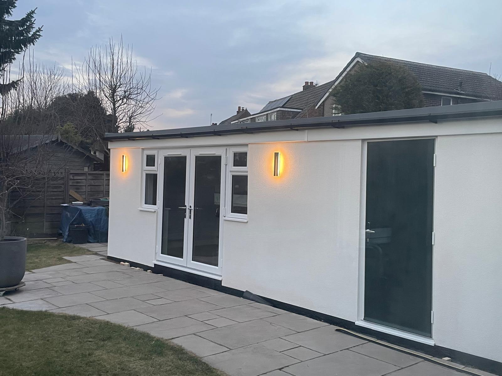 Finished garage office exterior at dusk
