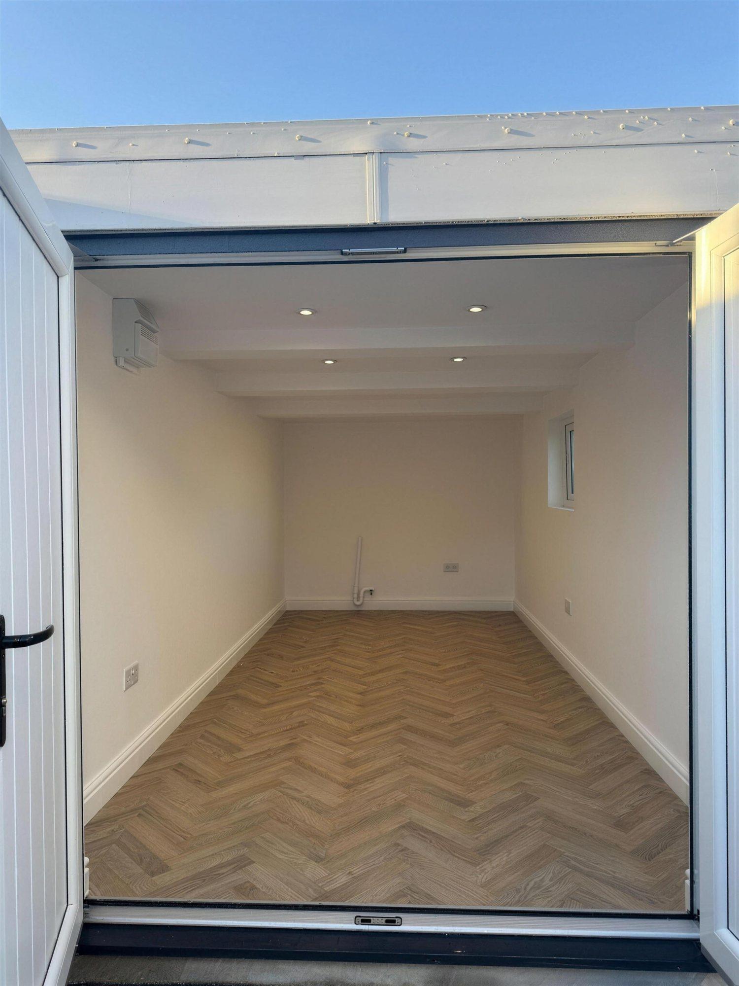 The finished utility room, white walls and new floor